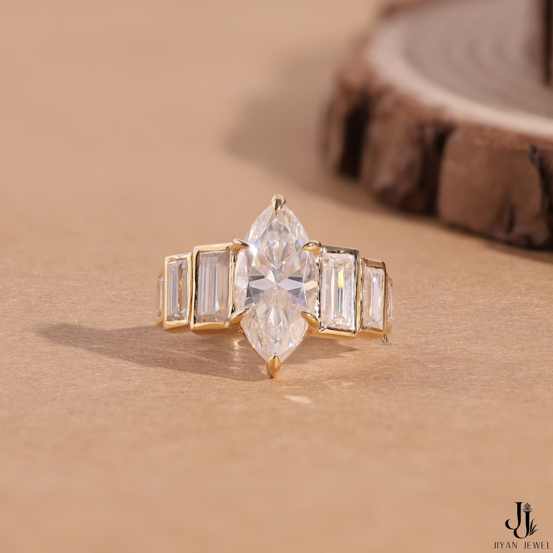 Art-deco marquise ring with graduated baguettes in yellow gold